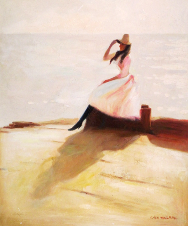 A girl holding her hat  